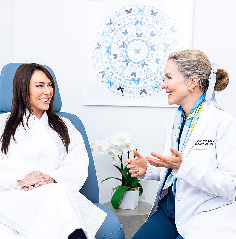 Patient consultation in a cosmetic surgery setting.