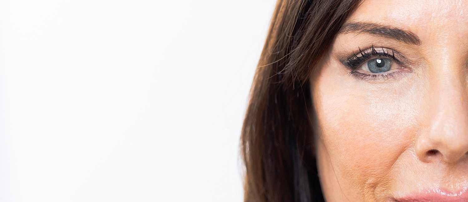 Close-up of a woman's eye and cheek.
