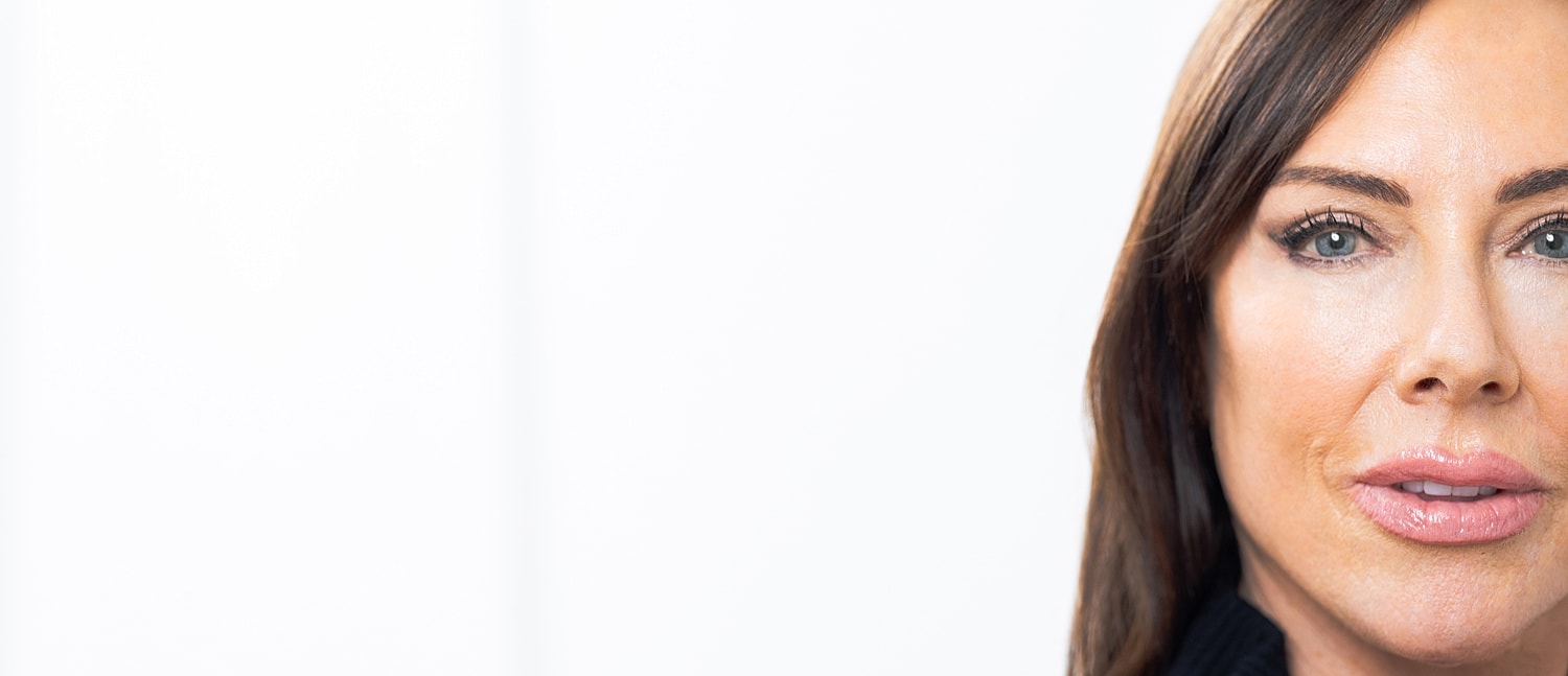 Close-up portrait of a woman with long hair.