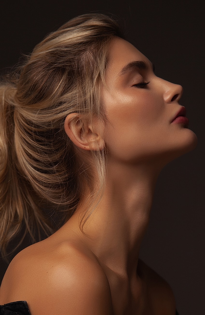 Profile of a woman with elegant hairstyle.