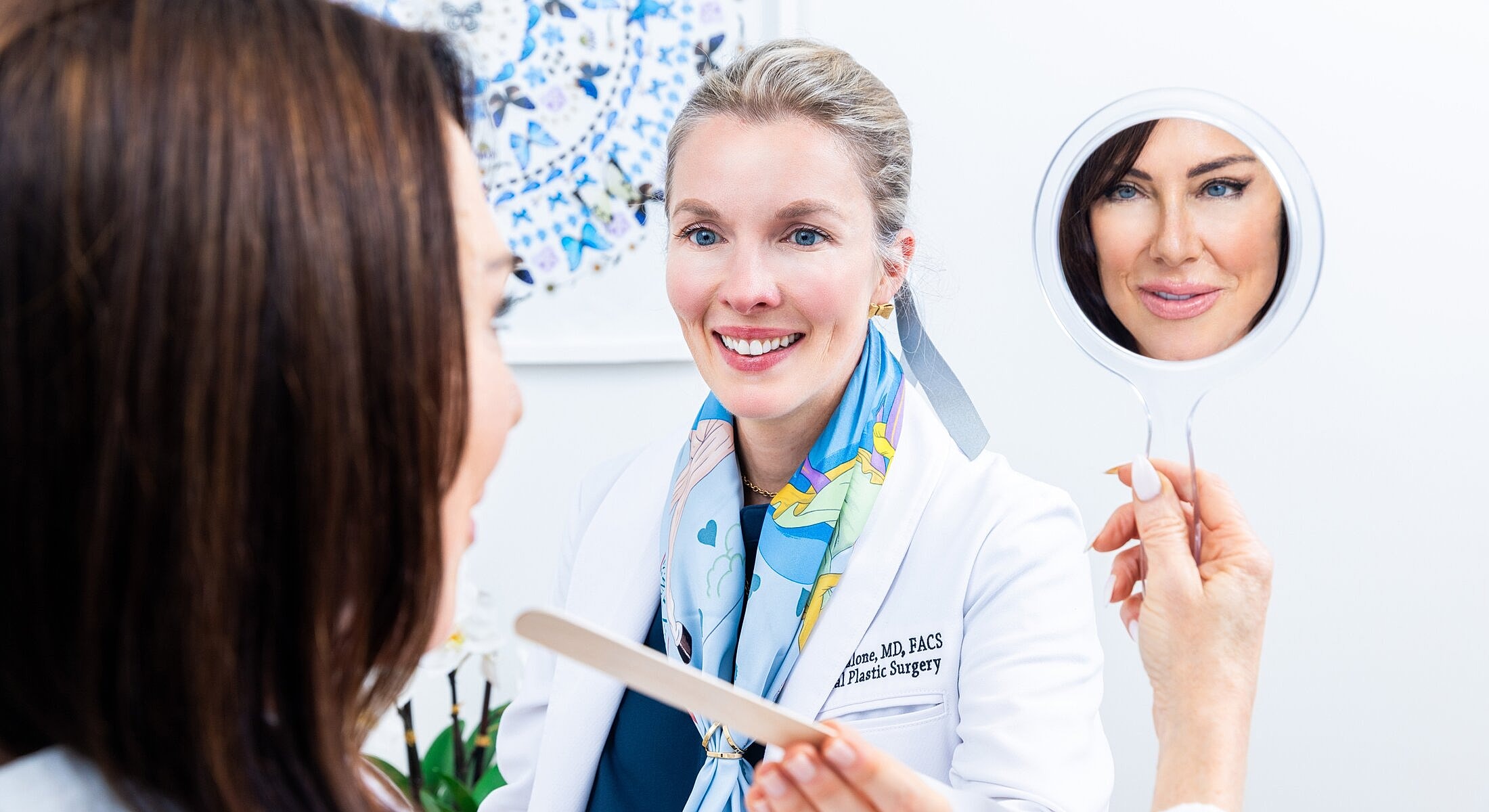 Doctor consulting with patient in a clinic setting.