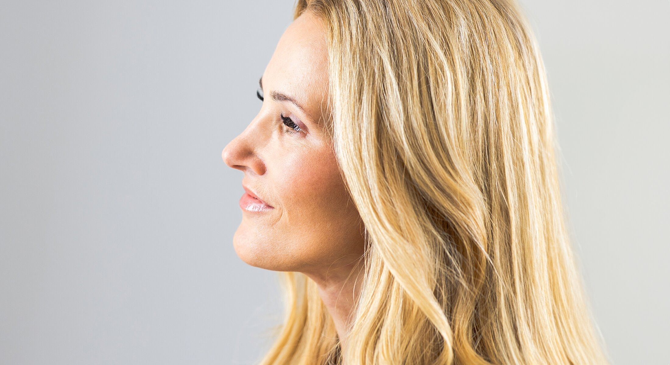 Profile view of a woman with long hair.