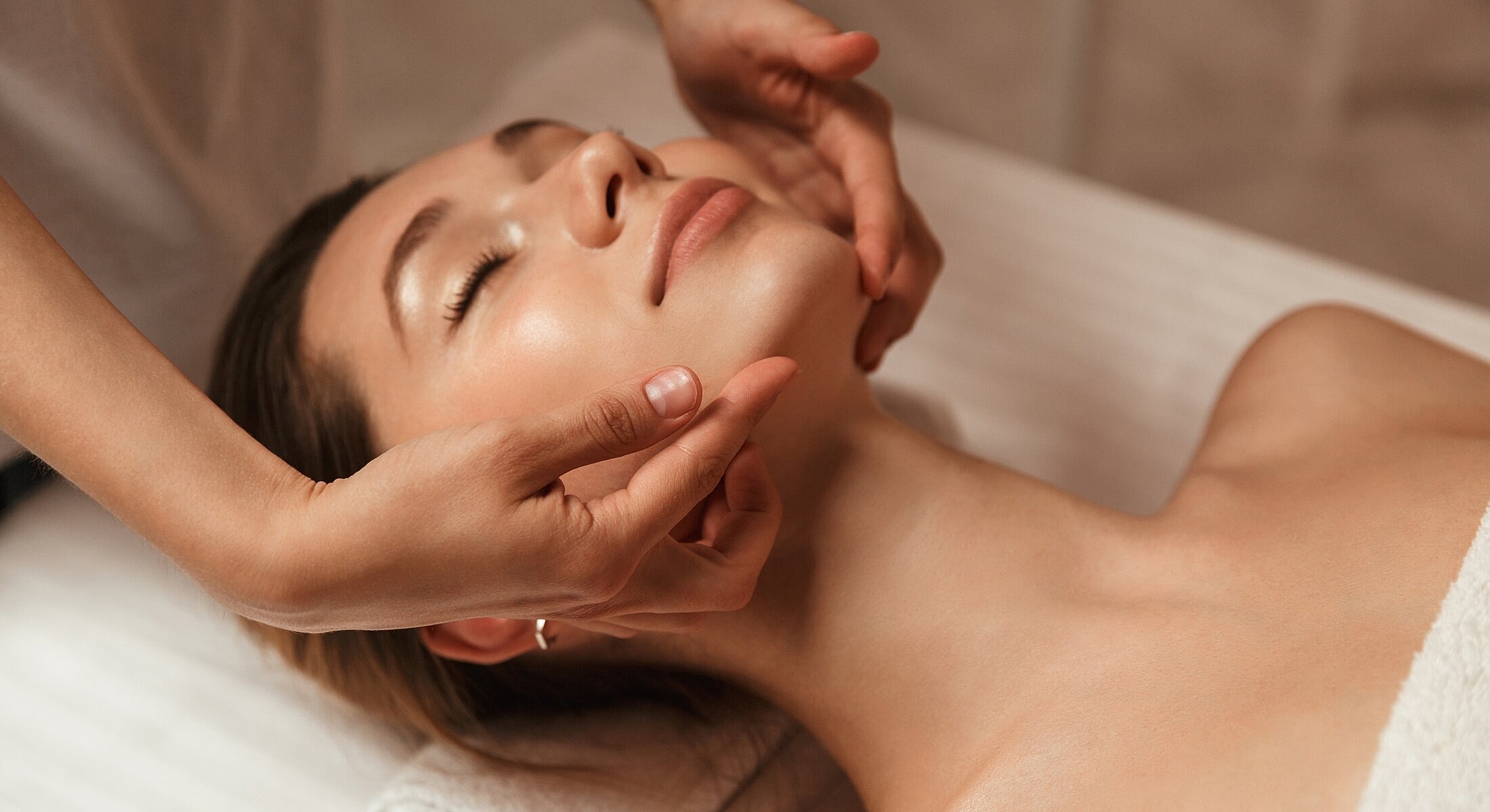 Facial massage treatment in a serene environment.