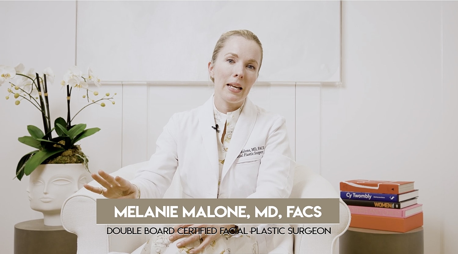 Doctor discussing facial plastic surgery techniques.